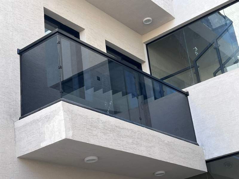 modern black framed glass railing installation for villa balcony in riyadh